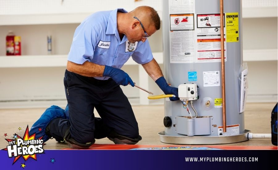 Technician checking water heater thermostat